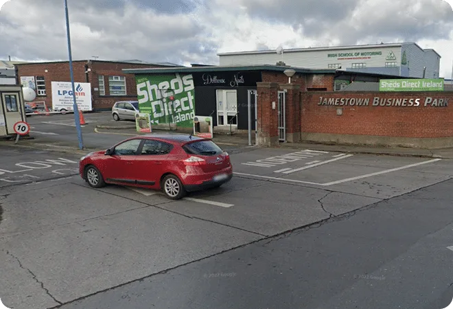 A_car_is_parked_outside_a_business_park_ISM_Driving_Lessons