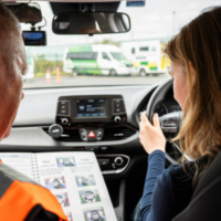 woman_sit_in_a_car_and_learning_driving_ISM_Driving_lessons