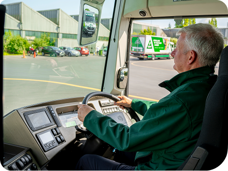 A_man_focused_on_driving_a_truck_on_a_clear_road_ISM_Driving_lessons