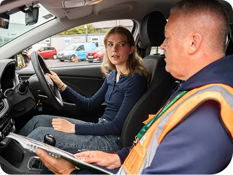 Young_lady_sitting_in_Driving_seat_with_instructor_ISM_Driving_Lessons