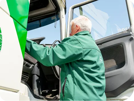 Man_is_positioned_in_the_driver's_seat_of_a_truck_ISM_Driving_Lessons