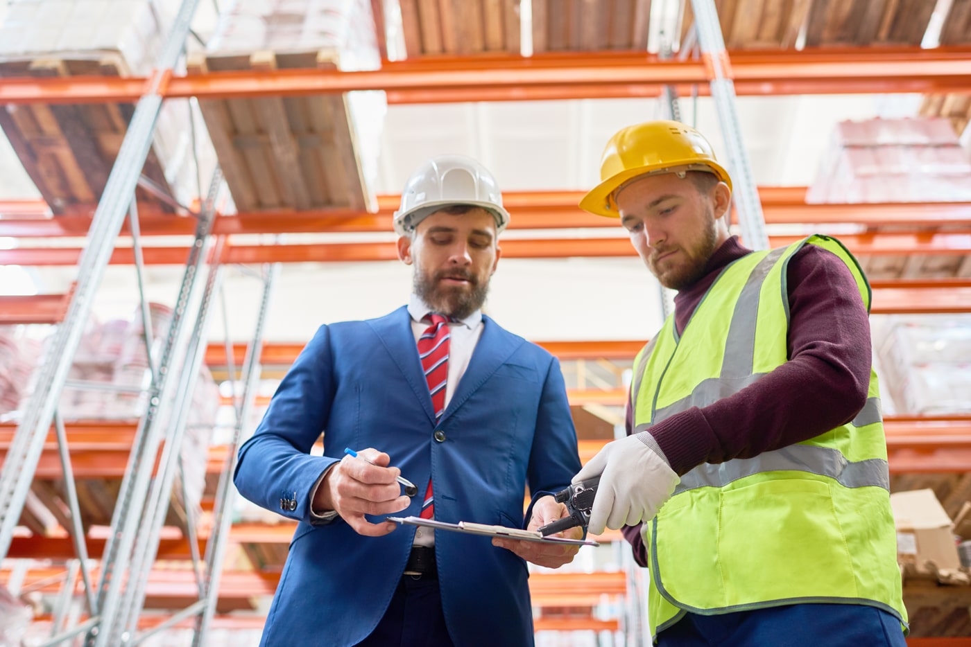 Two_men_wearing_hard_hats_and_safety_vests _ISM_Training_and_Recruitment